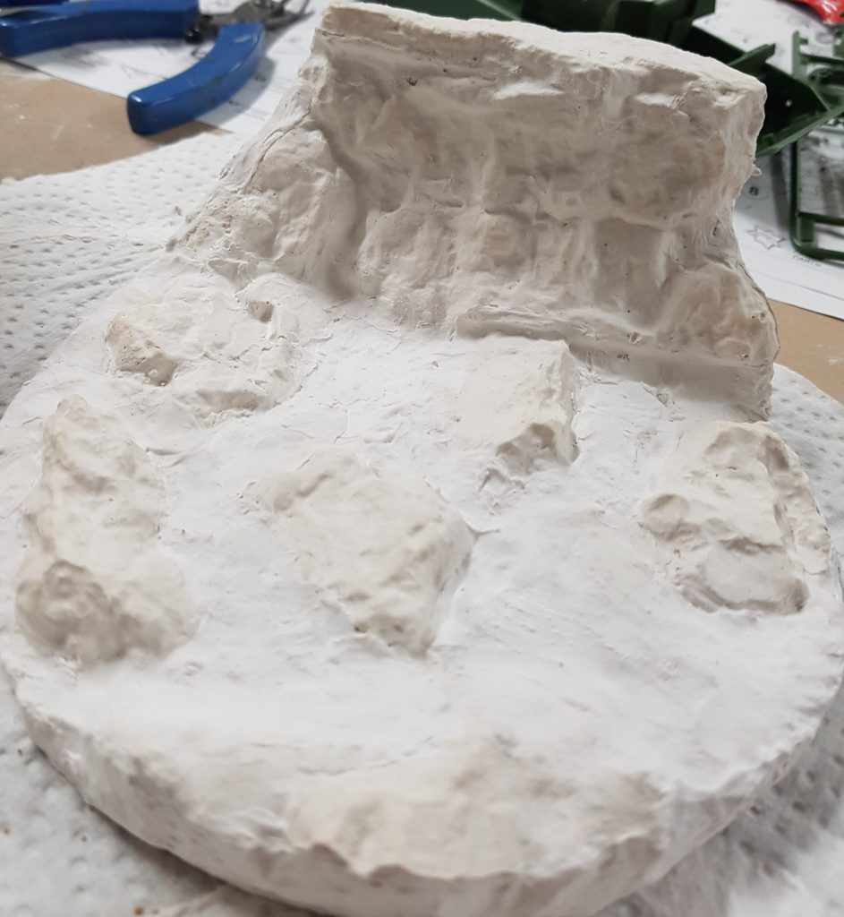 Base fully sculpted and cast from plaster